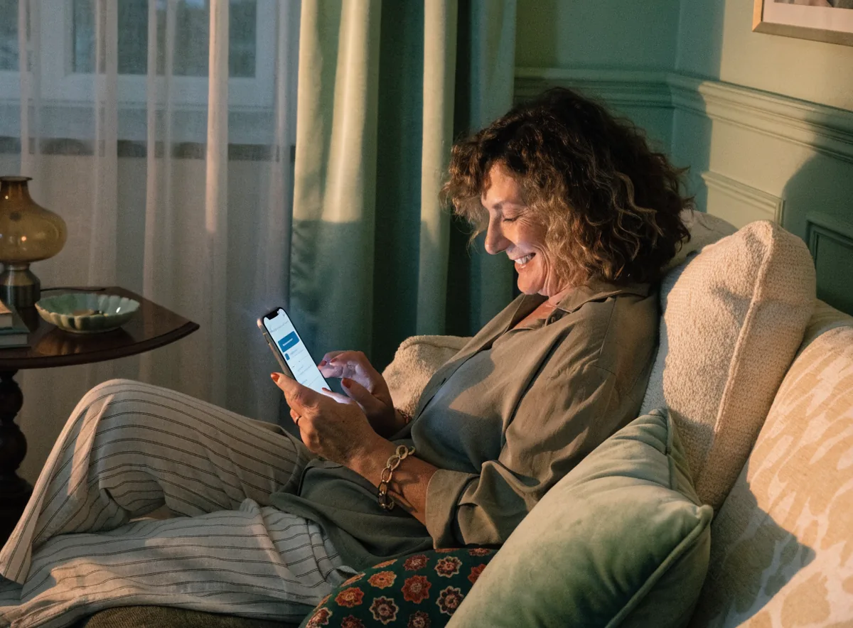A patient on her phone at home