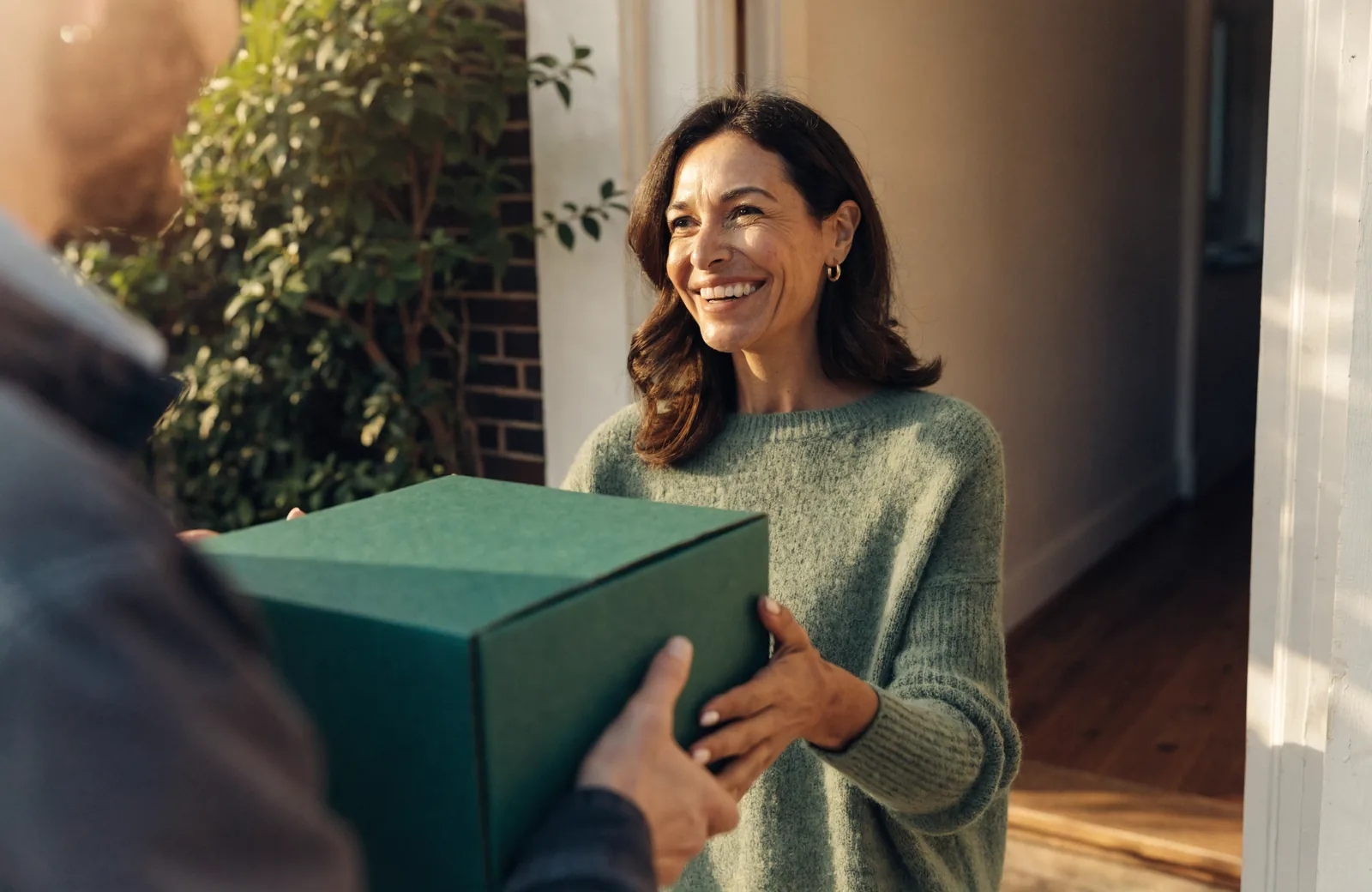 A Pharmaneek package delivered to a front door