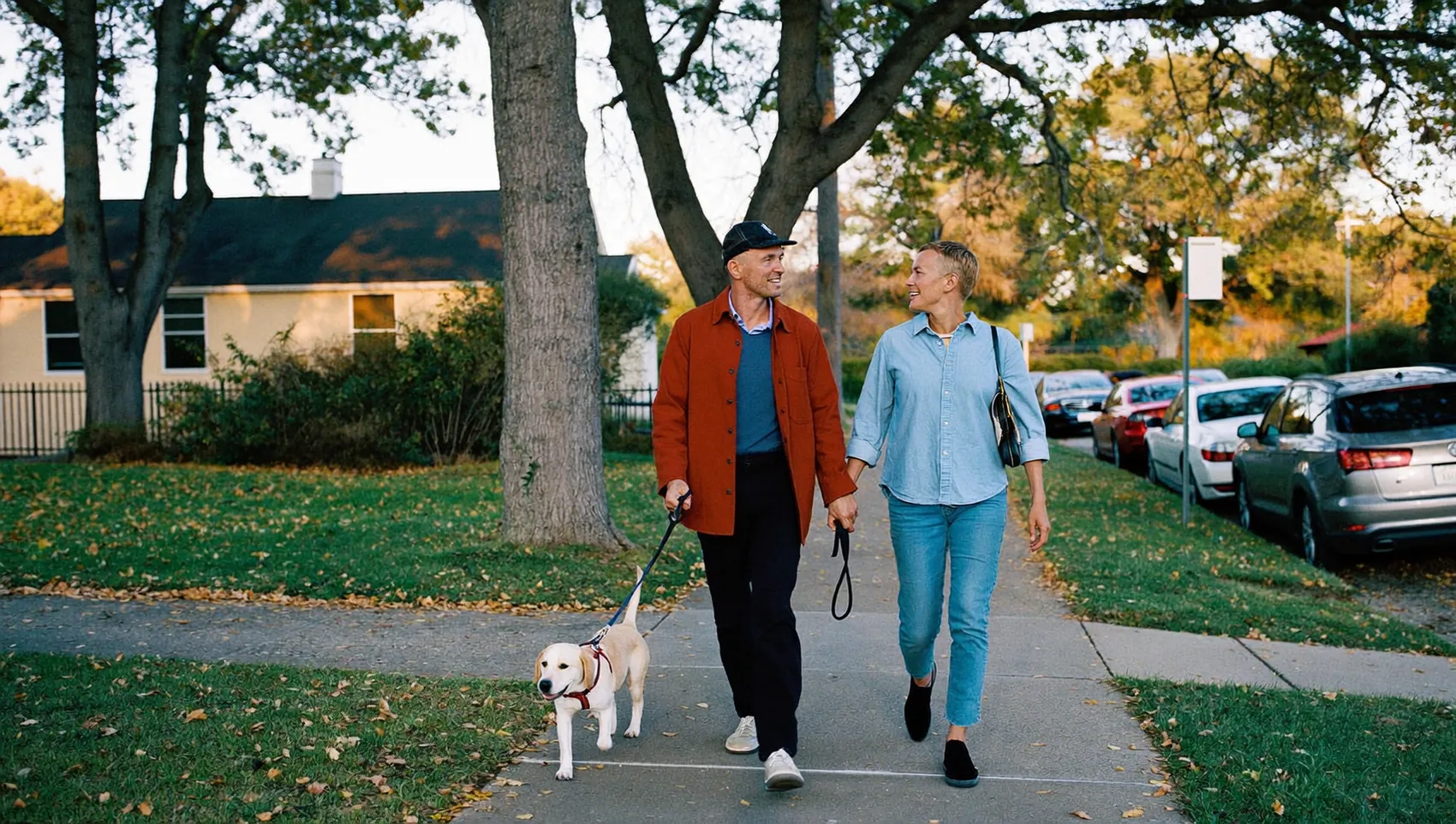 Couple walking their dog in the evening